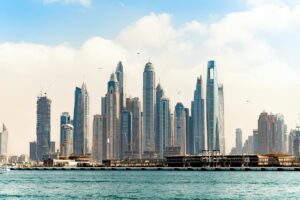 Dubai skyline representing real estate market with digital marketing analytics overlay, symbolizing real estate SEO success for new businesses.