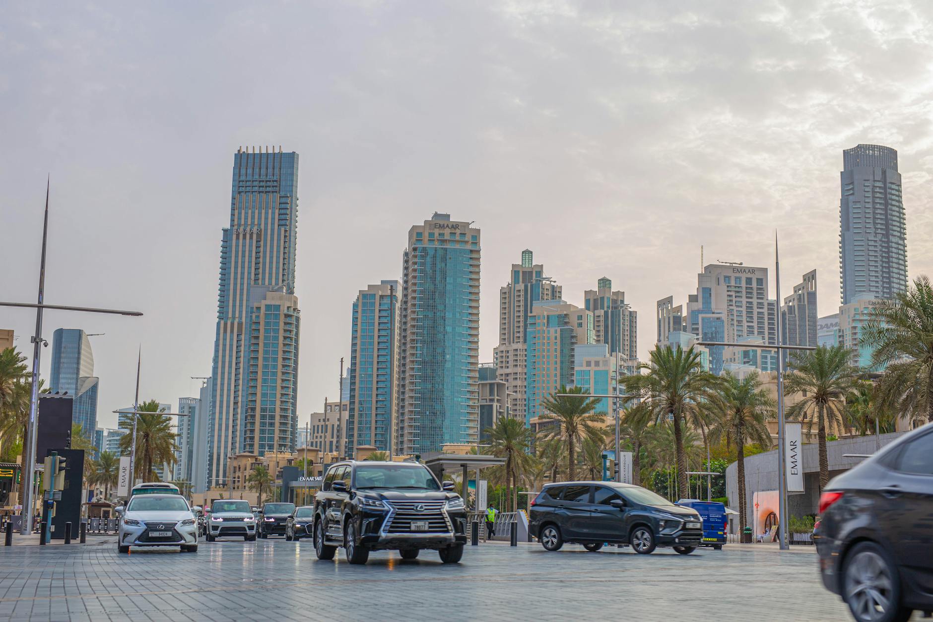 Digital marketing dashboard showing SEO analytics for car rental in Dubai, with a backdrop of the Dubai skyline and luxury cars.