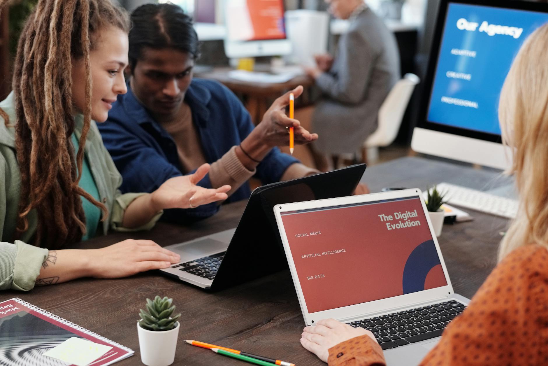 A team from a top digital marketing agency in UAE collaborating in a modern office, with a blurred Dubai skyline in the background, symbolizing strategic growth for new businesses.