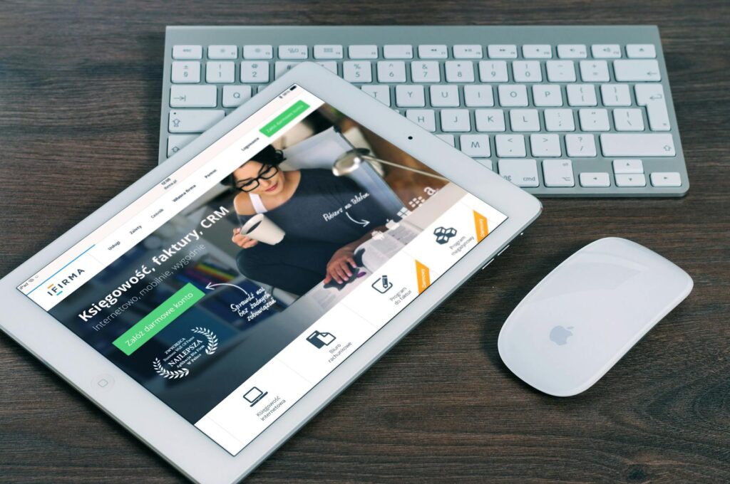 A smartphone and tablet displaying the same website, perfectly adapted to each screen size, symbolizing a mobile responsive website for a new business.