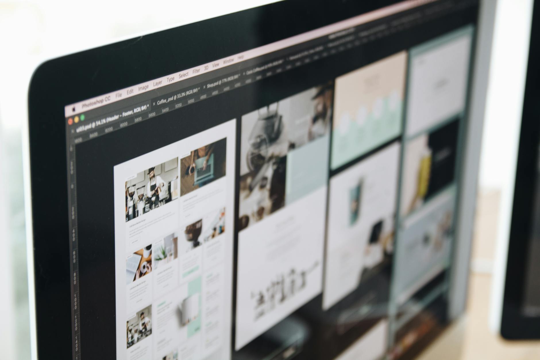 A sleek, modern business website interface displayed on a laptop, showcasing various web design trends like clean layouts, engaging visuals, and mobile responsiveness.